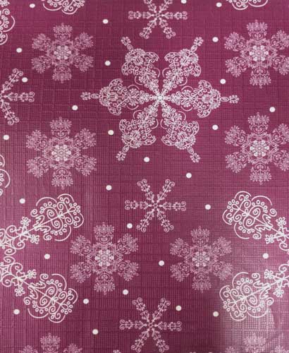 Closeup of Burgundy Festive Holiday Snowflake Peva Table Cloth fabric