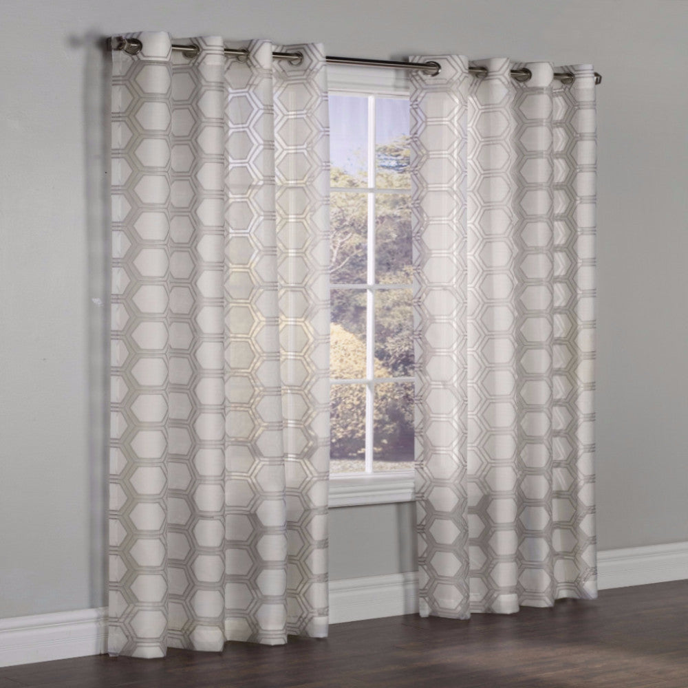 Taupe Madison Grommet Top Panel hanging on a decorative curtain rod