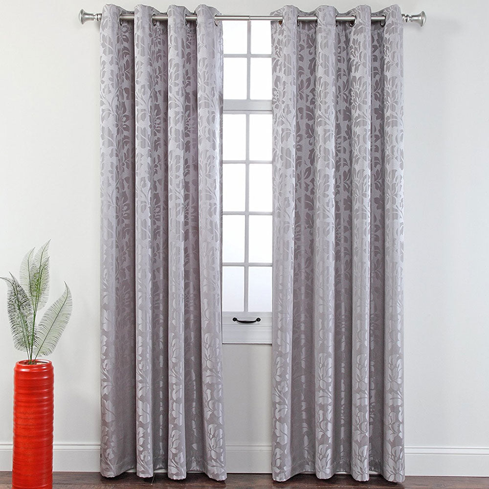 Stone Leah Jacquard Grommet Panel hanging on a decorative curtain rod