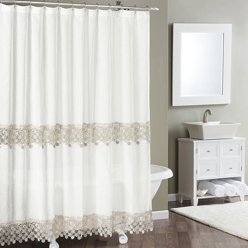 Ivory Lillian Macramé Band Fabric Shower Curtain hanging on a shower curtain rod
