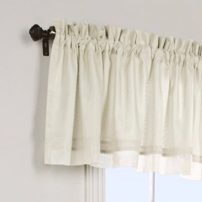 Closeup of Ivory Rhapsody Lined Tailored Valance hanging on a curtain rod
